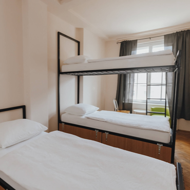 Mixed shared room with 3 beds